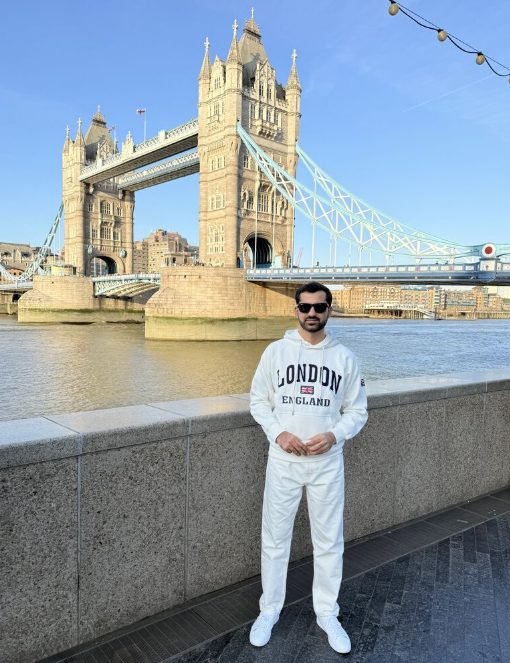 Salman Nasir standing by Tower Bridge in London